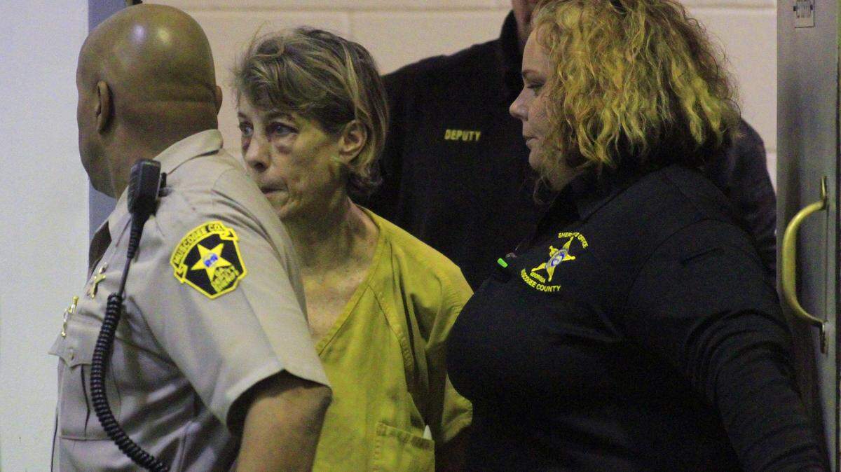 Kathryn Ann Adams is escorted Tuesday afternoon into Columbus Recorder's Court for a preliminary hearing. Adams faces 18 charges including murder, first-degree homicide by vehicle, theft by taking motor vehicle, DUI and leaving the scene of an accident, officials said. 12/22/15