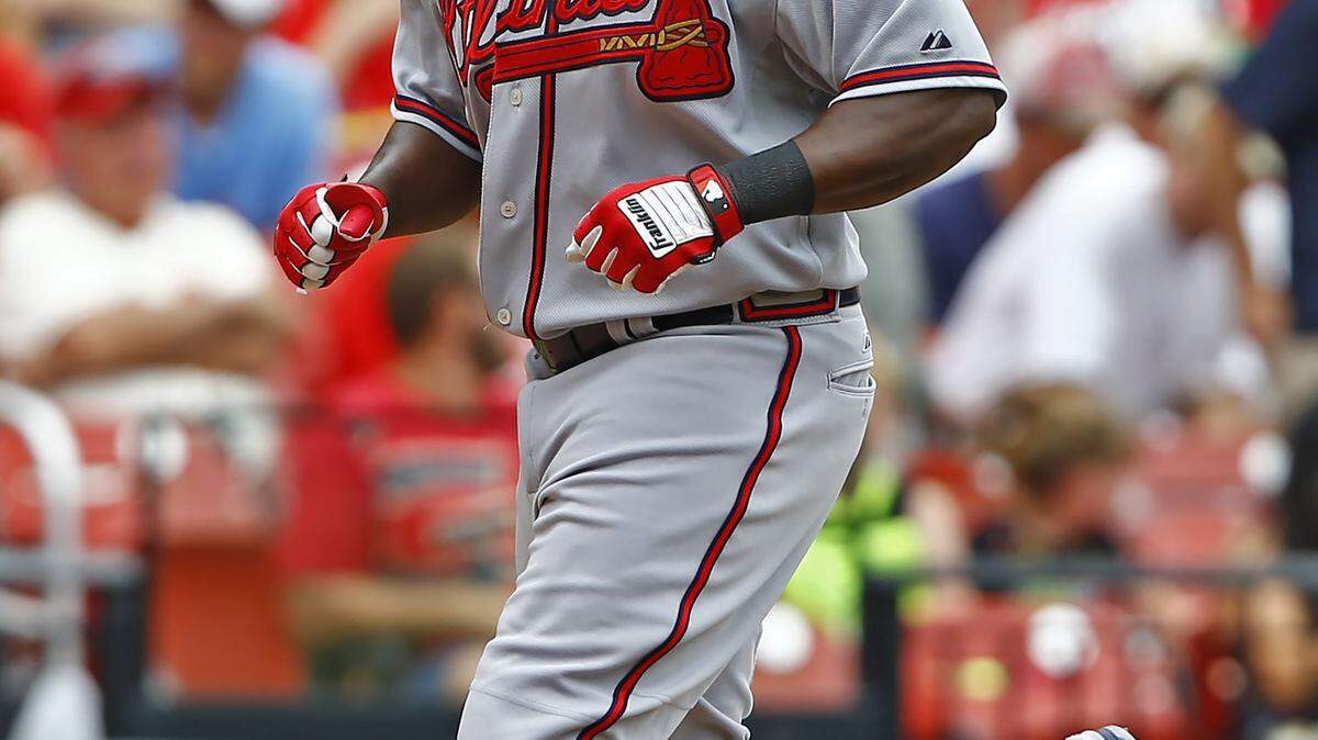 Atlanta Braves' Adonis Garcia looks to the sky as he crosses the plate after hitting a solo home run off of St. Louis Cardinals starting pitcher Michael Wacha during the sixth inning of a baseball game Sunday, July 26, 2015, in St. Louis. The Braves won the game 3-2. (AP Photo/Billy Hurst)