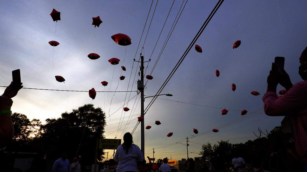 Family and friends of Dontrell Williams release balloons in his memory on April 27, 2021 at the Circle K convenience store at 5448 Forrest Rd. in Columbus, Georgia to remember what would have been Williams’ 28th birthday. Dontrell Williams was shot and killed in 2019 while working an overnight shift at this same store.