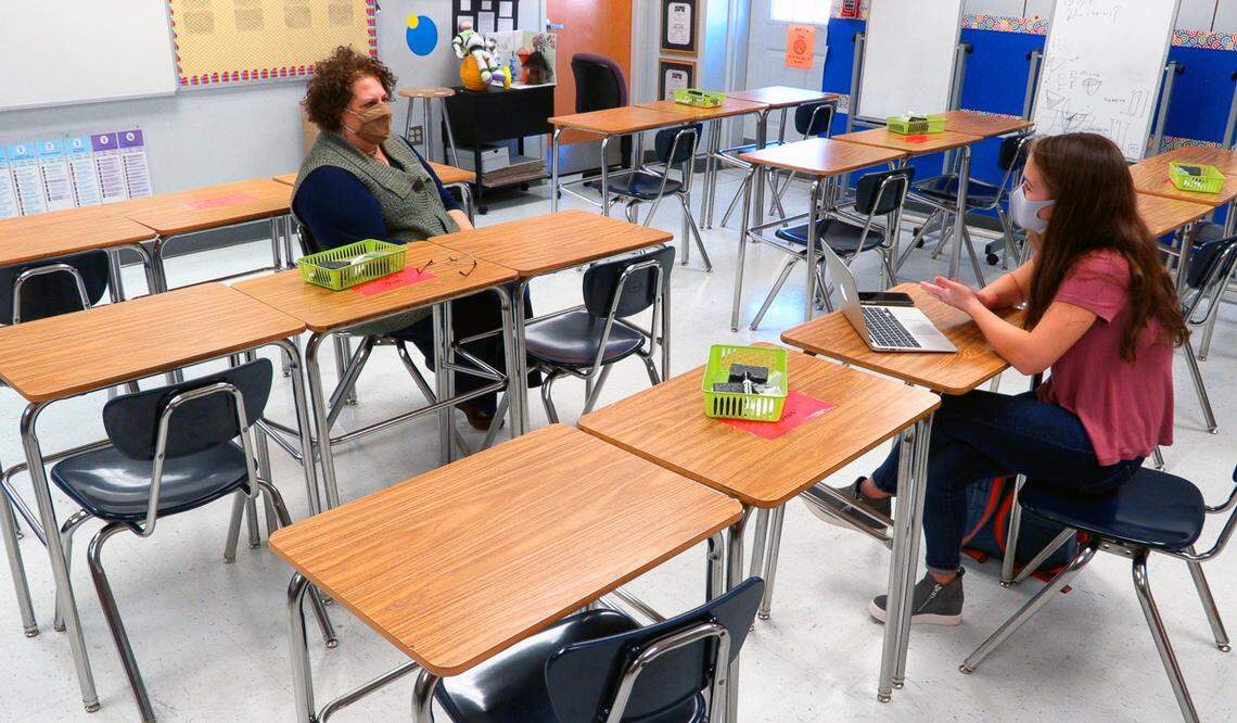 Columbus High School student Laura Kate Holden, right, interviews Storie Atkins for a podcast. Atkins is a math teacher and chair of the math department at Columbus High School.