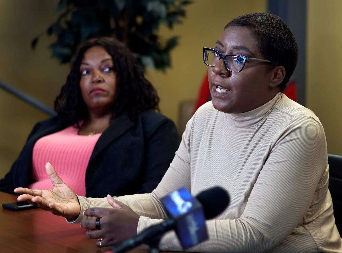 Adrienne Pollard, right, the widow of David Pollard, speaks during a Wednesday afternoon press conference in Columbus, Georgia about the 2016 death of her husband in a fatal car crash. 10/18/2023