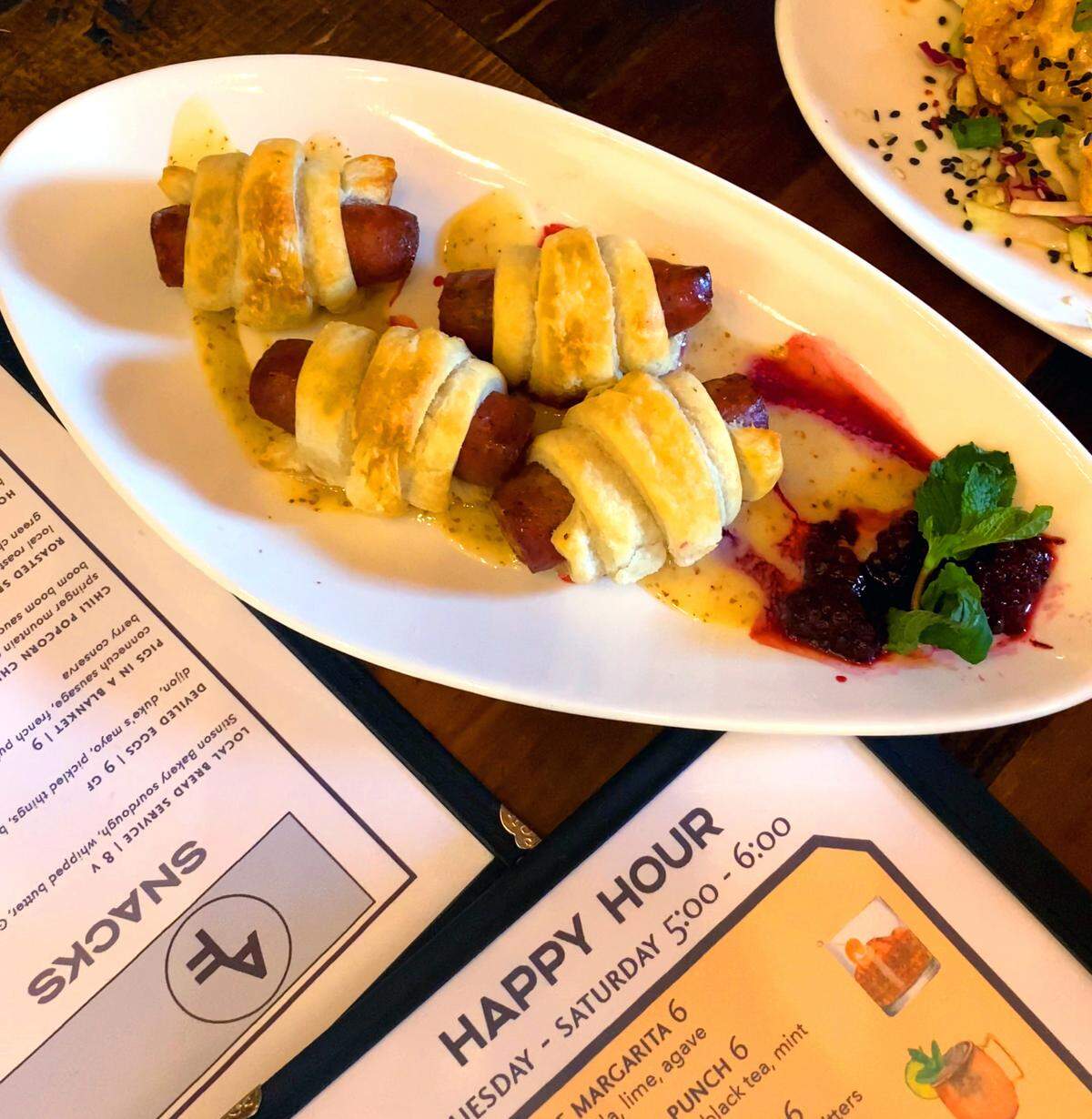 Ledger-Enquirer reporter Sundi Rose went to Happy Hour at Animal Farm in Columbus, Georgia for Columbus on a Budget. She ordered the pigs in the blanket ($7) as one of her appetizers.