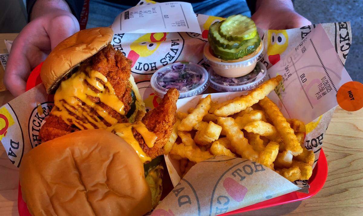 This is the Dave’s #2: Two sliders with fries combination at Dave’s Hot Chicken in Columbus, Georgia. Each slider is served on a potato bun with kale slaw, pickles and drizzled with Dave’s sauce. 01/28/2025
