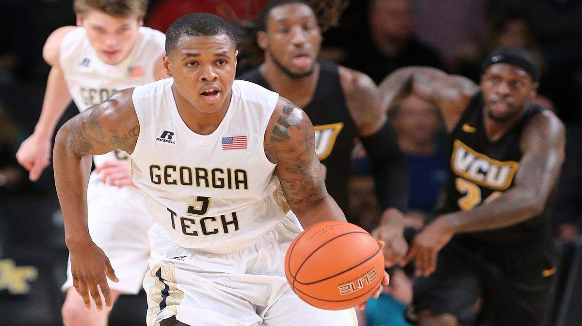Georgia Tech guard Marcus Georges-Hunt breaks away from TCU players after a Georgia Tech steal during the first half of an NCAA college basketball game Tuesday, Dec. 15, 2015, in Atlanta. (Curtis Compton/Atlanta Journal Constitution via AP)