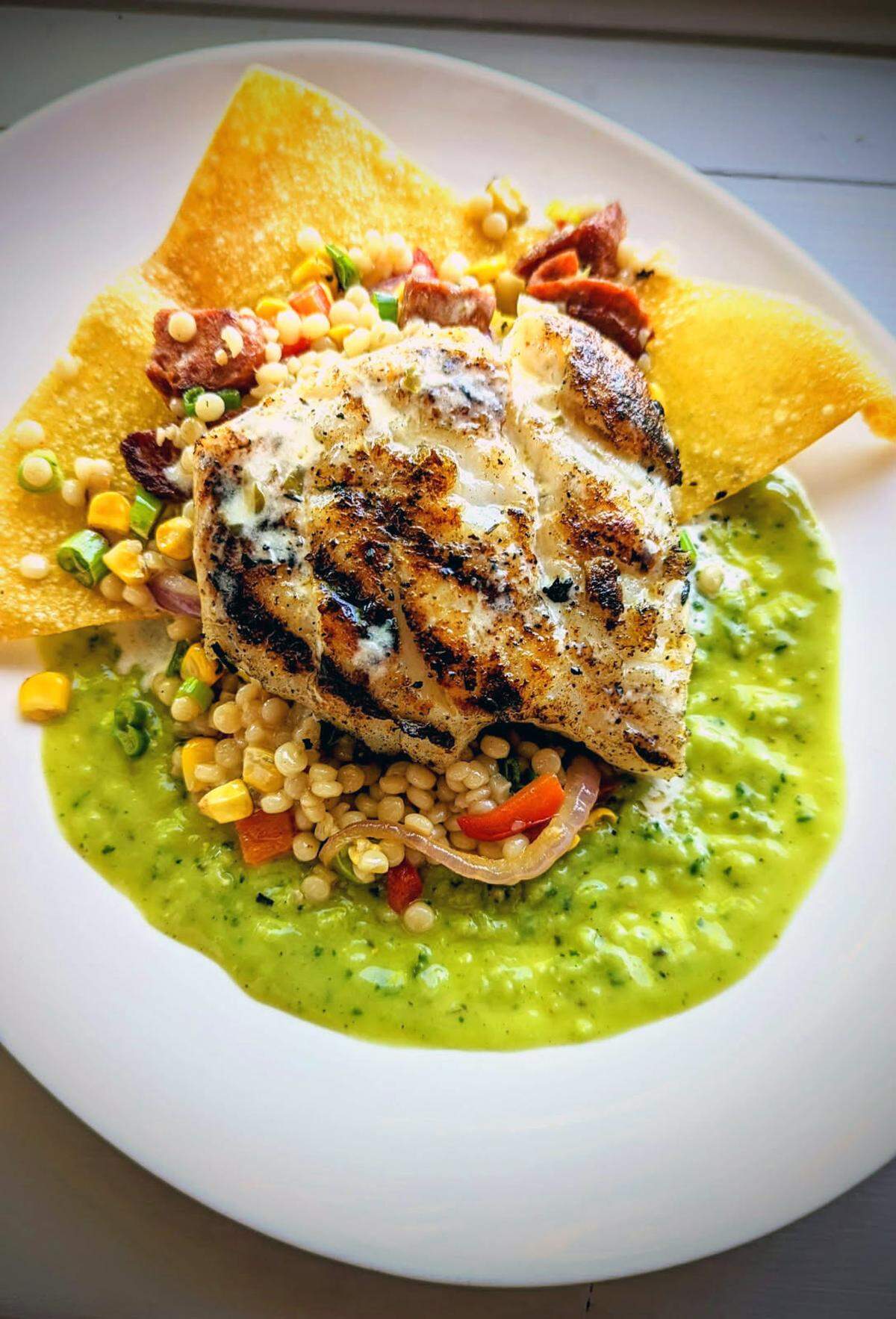 Seafood is the go-to for Mother’s Day at Wicked Hen in Columbus with options including the Fire-Grilled Scamp Grouper.