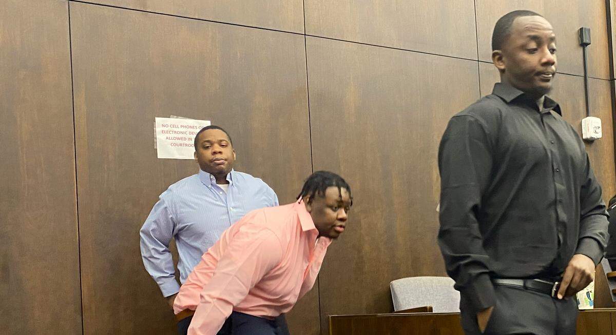 The suspects on trial are, left to right, Terrance Upshaw, Rodderick Glanton, and Homer Upshaw.
