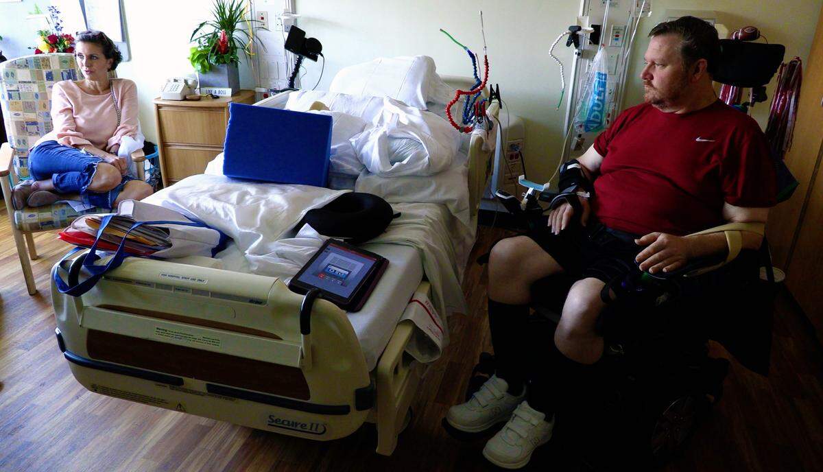 Mark Jones, right, and his wife Sheri discuss Mark's rehabilitation during a Tuesday interview in his room at the Shepherd Center in Atlanta. Jones is at the Shepherd Center recovering from a spinal cord injury he sustained in an automobile accident.