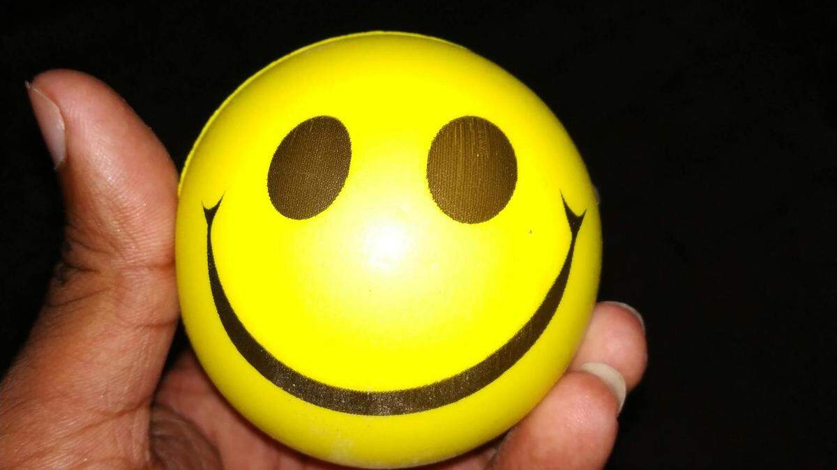  https://www.pexels.com/photo/person-holding-emoticon-ball-1579371/