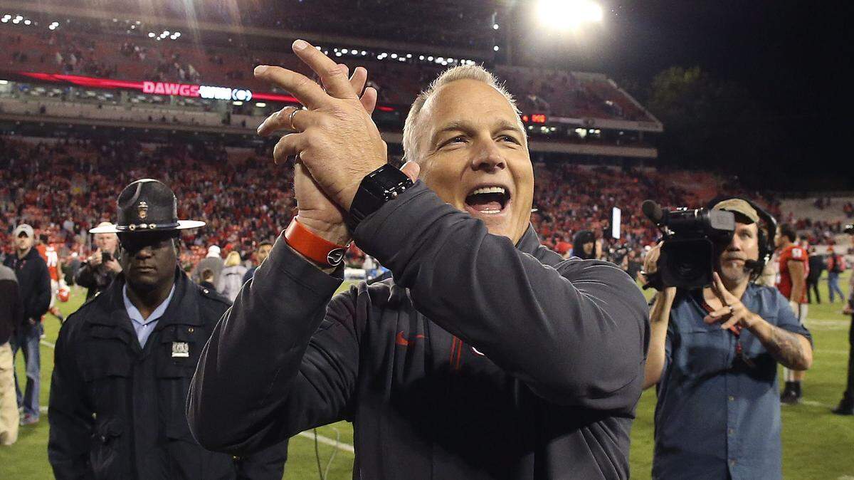 JOHN BAZEMORE/Associated PressGeorgia head coach Mark Richt celebrates with fans after beating Missouri 9-6 in an NCAA college football game Oct. 17 in Athens, Ga.