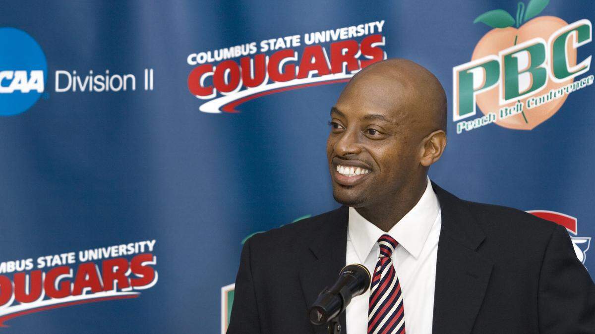Robin Trimarchi rtrimarchi@ledger-enquirer.com 
 Robert Moore addresses the crowd after being name the Columbus State University head men's basketball coach Friday by athletic director Jay Sparks. Moore was a CSU assistant coach under head coach Herbert Greene from 1994-2000, and has coached boys basketball at Brookstone since 2005. 04.09.10
