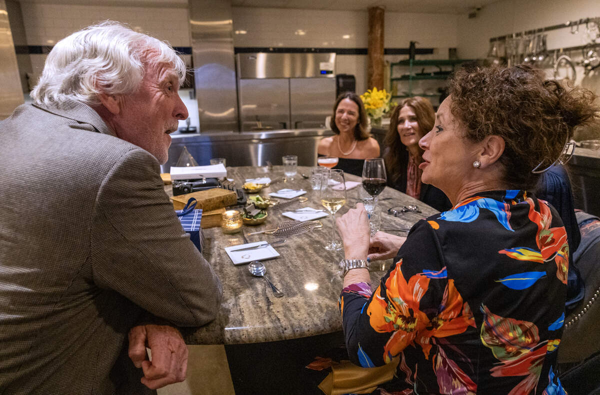 Allen Levi, author of the bestselling novel “Theo of Golden,” surprises the “THEO-logians” during their dinner at the Epic Restaurant chef’s table in Columbus.