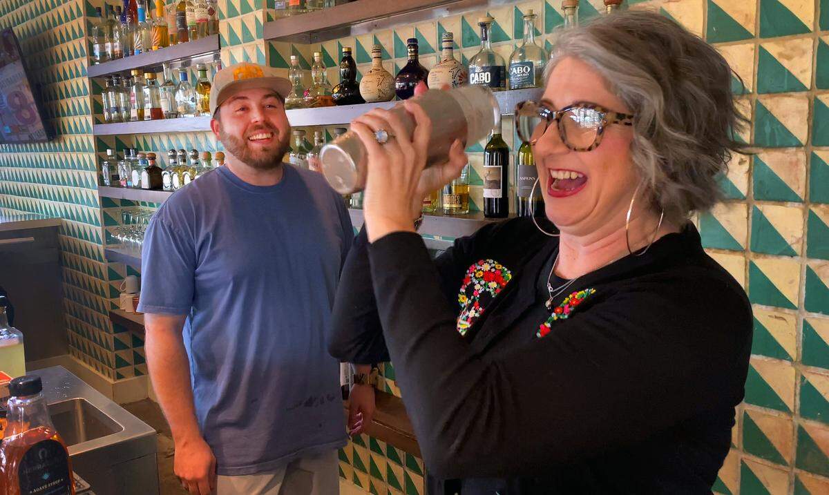 Cole Butterfield, bartender at Pure Taqueria in Columbus, teaches Ledger-Enquirer reporter Sundi Rose how to make a margarita on May 3, 2024.
