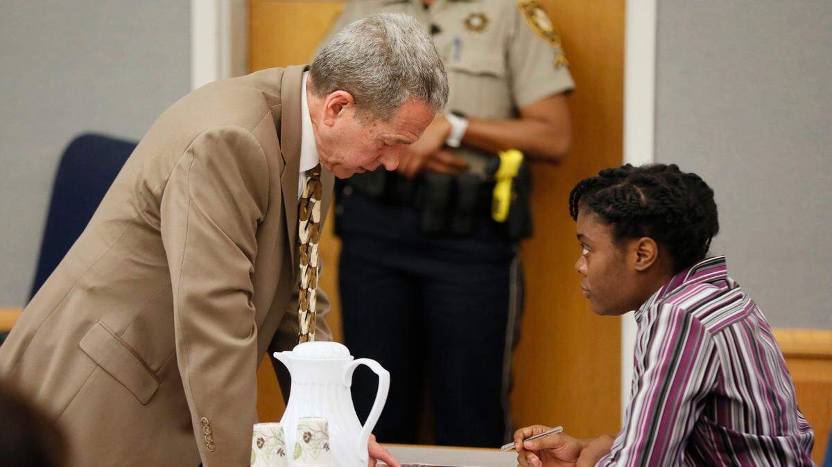 April 25, 2019 - Lawrenceville - District Attorney Danny Porter discusses prosecution exhibits that are being entered into evidence with Tiffany Moss. The prosecution continued for the second day in the Tiffany Moss death penalty trial with the testimony of Eman Moss. Moss, who is representing herself, again declined to ask questions of the prosecution witnesses. Bob Andres / bandres@ajc.com