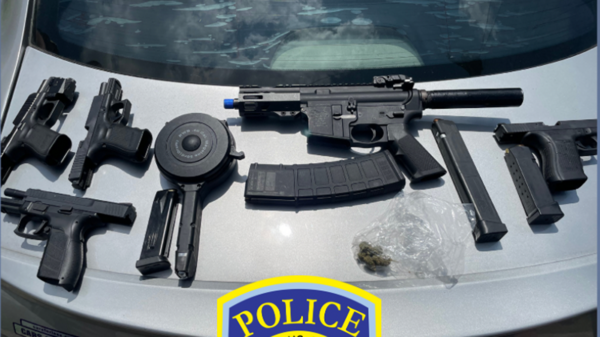 Columbus police seized five firearms in a June 2023 traffic stop., Two weapons (far left and second from left, top)had been illegally modified with switches.