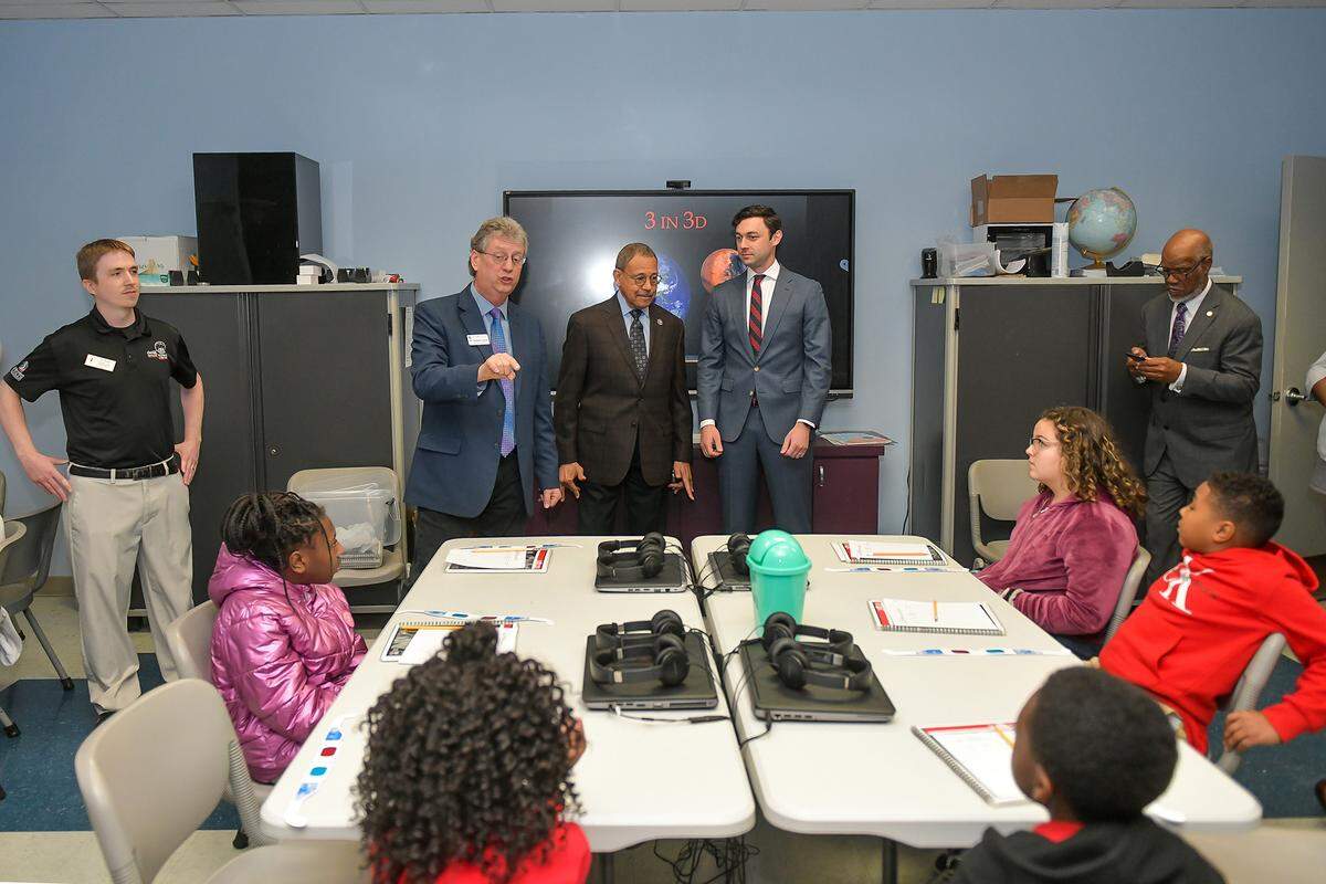 Shawn Cruzen, professor and director of Columbus State University’s Coca-Cola Space Science Center, Congressman Sanford D. Bishop, and U.S. Senator Jon Ossoff visit with students from Rigdon Road Elementary Thursday morning at the center. 01/19/2023