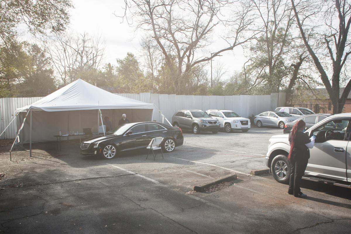 Georgia physicians with the group Covid Solutions work on a rotating schedule at a drive-thru COVID-19 testing site located in the parking lot of Greater Ward Chapel AME Church in Columbus, Ga. on Jan. 10, 2022.