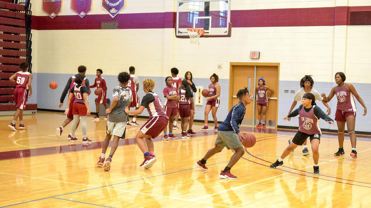 The Carver High School girls basketball team scrimmages against the junior varsity boys Tuesday, March 5, 2019, as the varsity boys warm up on the sideline. Both teams will play Friday in the Georgia High School Association 2019 Class AAAA state championship games at the Macon Coliseum.