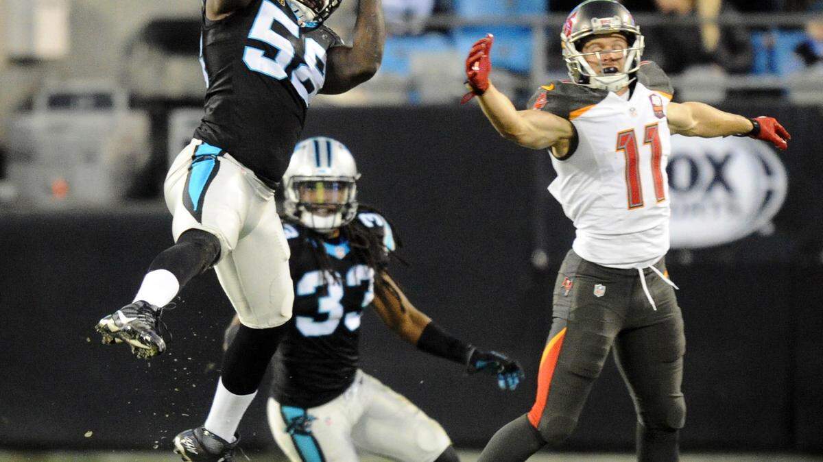 Carolina Panthers' Thomas Davis intercepts a pass intended for Tampa Bay Buccaneers' Adam Humphries (11) during the second quarter at on Sunday, Jan. 3, 2016, at Bank of America Stadium in Charlotte, N.C. (David T. Foster III/Charlotte Observer/TNS)