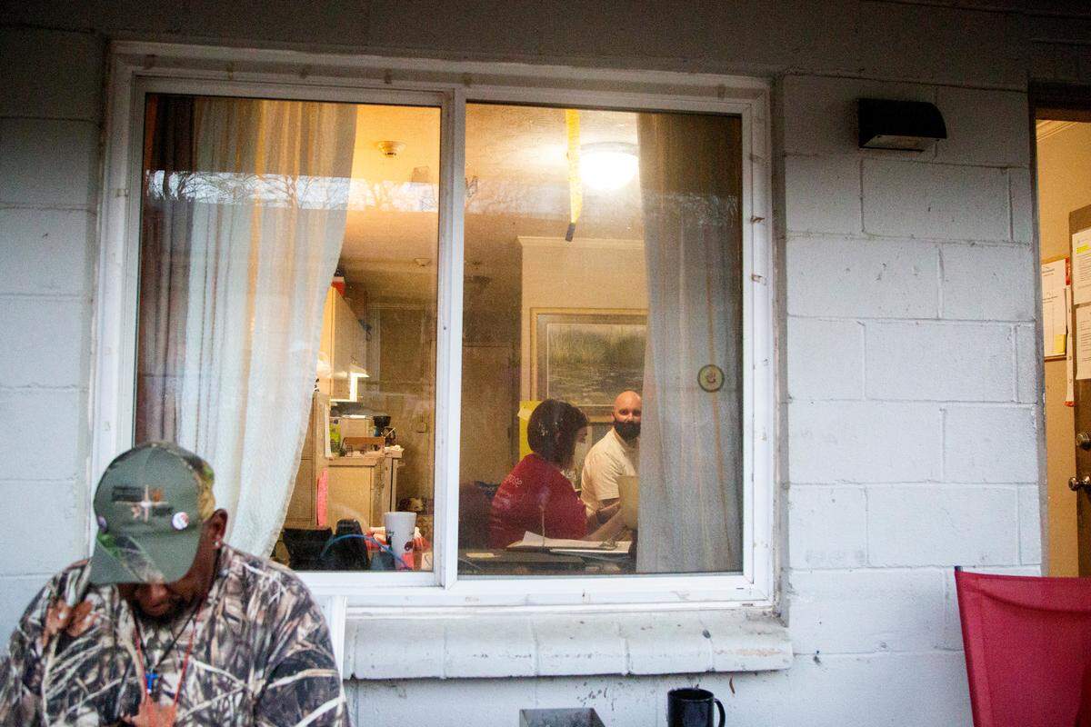 Residents at Grace House, a transitional living facility for men, wait to be surveyed for the Point in Time Count in Columbus, Ga. on Feb. 22, 2022. Home for Good executes an annual count of those experiencing homelessness in Muscogee and Russell County.