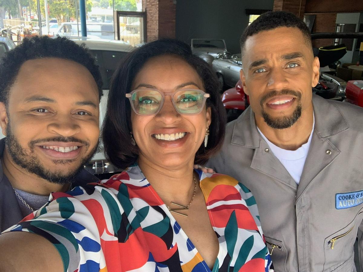Natalia Temesgen, a Columbus State University associate professor of English, poses with actors Eugene Byrd, left, and Michael Ealy on the set of the Hulu TV series “Reasonable Doubt” in May 2022 in Los Angeles. She is one of two executive story editors and among eight writers for the show.