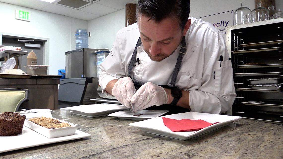 Epic Restaurant Chef Jamie Keating plates a Chocolate Torte, one of three desserts to top off the lunch menu for Restaurant Week 2018.