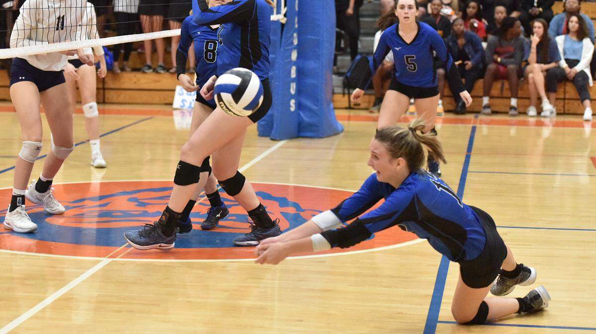 Columbus’ Sydney James makes diving dig to keep the ball in play in during the third set of Georgia Class AAAA semifinal match against Marist in the Columbus High School gym Tuesday night, October 30, 2018.