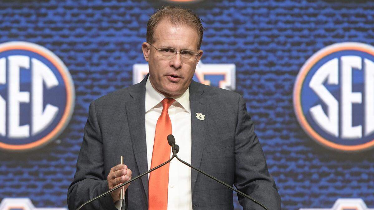 NCAA college football head coach Gus Malzahn of Auburn speaks during the Southeastern Conference Media Days at the College Football Hall of Fame in Atlanta, Thursday, July 19, 2018
