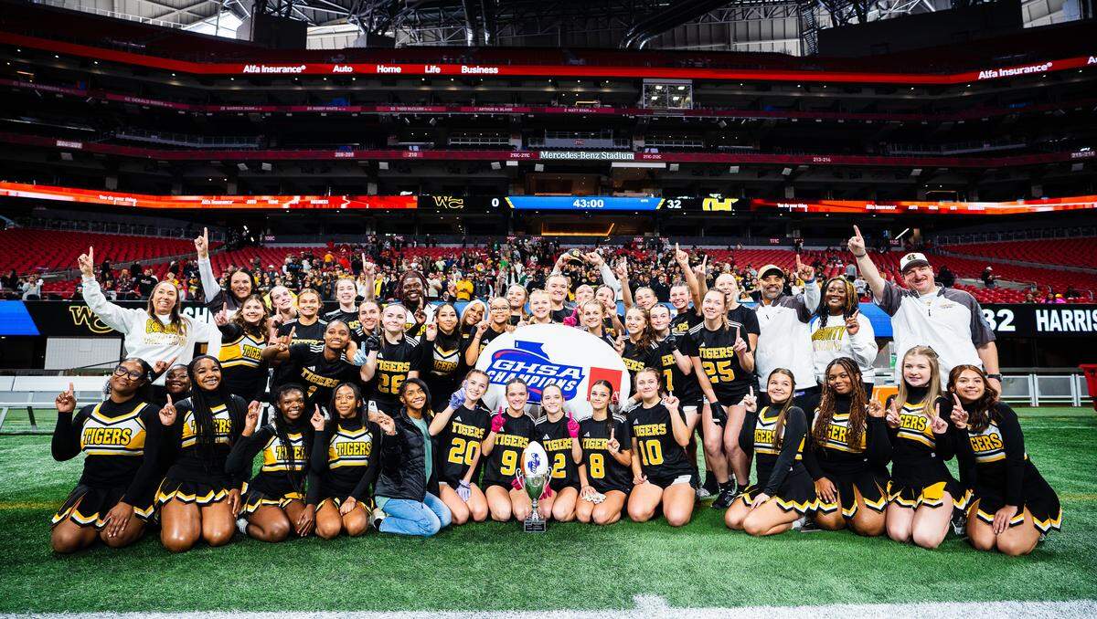 The Harris County High School flag football team and supporters celebrate winning the Georgia High School Association Division 1 state championship game 32-0 over Washington County on Dec. 15, 2025, at Mercedes-Benz Stadium in Atlanta.