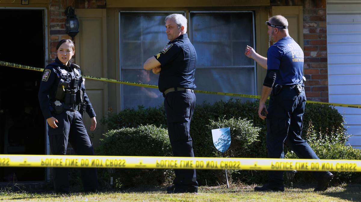 Law enforcement officers are at 915 Wehring Lane in Phenix City the morning of Oct. 14, 2025, after four members of a family died in a house fire the previous night, according to Russell County Coroner Arthur Sumbry Jr. The cause of death is due to “possible smoke inhalation,” Sumbry said., and the cause of the fire is under investigation.