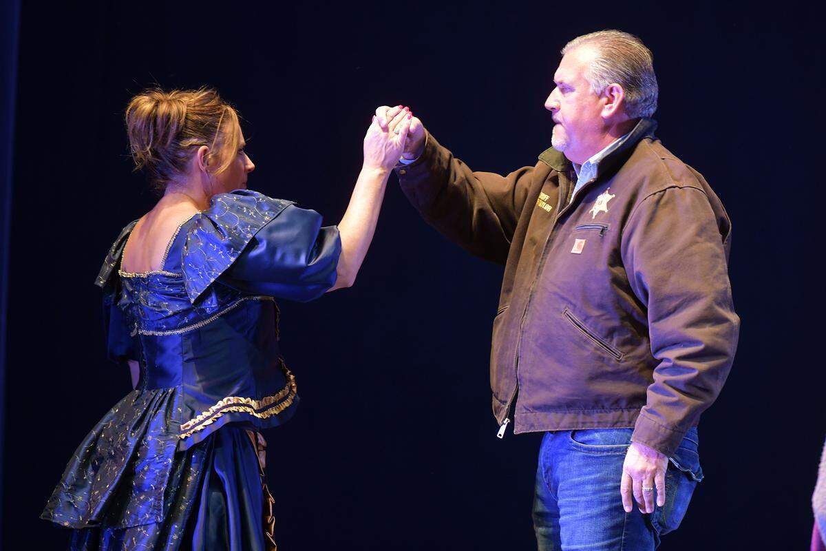 Russell County Sheriff Heath Taylor and his wife, Kristi, practice dancing on stage at the RiverCenter for the Performing Arts in Columbus during rehearsal Dec. 12, 2023, for their roles in the Columbus Ballet’s production of “The Nutcracker” Dec. 16 and 17.