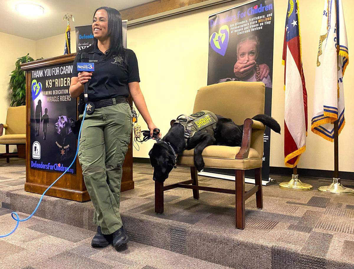 Muscogee Sheriff Investigator Brittney Kumar talks to Columbus reporters who came to meet Ryder, an electronic-device detection dog trained to find evidence in child pornography and sexual exploitation cases.