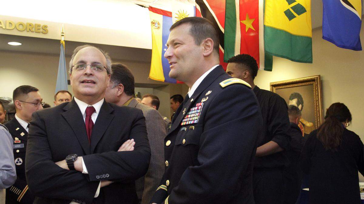 ROBIN TRIMARCHI rtrimarchi@ledger-enquirer.com 
 Col. Keith Anthony, WHINSEC commandant, right, and Frank Mora, director of the Ameican and Caribbean Center, School of International and Public Affairs at Florida International University, talk during a reception for the Western Hemisphere Institute for Security Cooperation 15th anniversary Thursday. 01.14.16