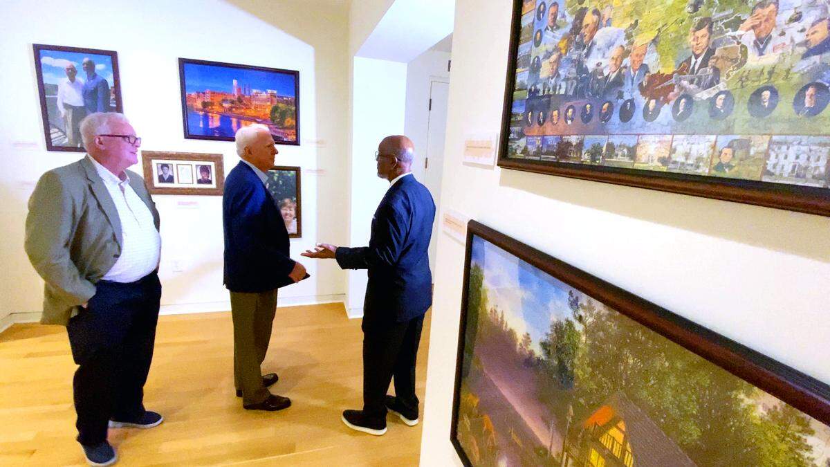 Retired state Rep. Calvin Smyre, right, greets visitors Feb. 18, 2026, at a new exhibition in the Columbus Museum titled “The Puzzle of Politics: Calvin Smyre in Service, 1975–2025,” which details his career as a political and community leader from Columbus.