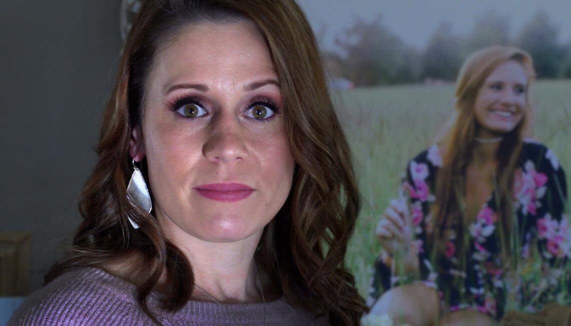 Andrea Mills stands in front of a portrait of her daughter Lexi Webb. On Feb. 6, 2019, Lexi, then a senior at Smiths Station High School, died by suicide.