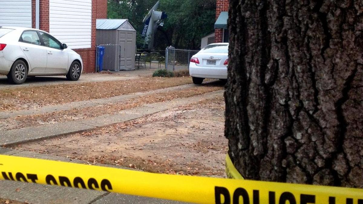 The Piper Cherokee came to rest on its nose in the backyard of 3528 Howard Ave.