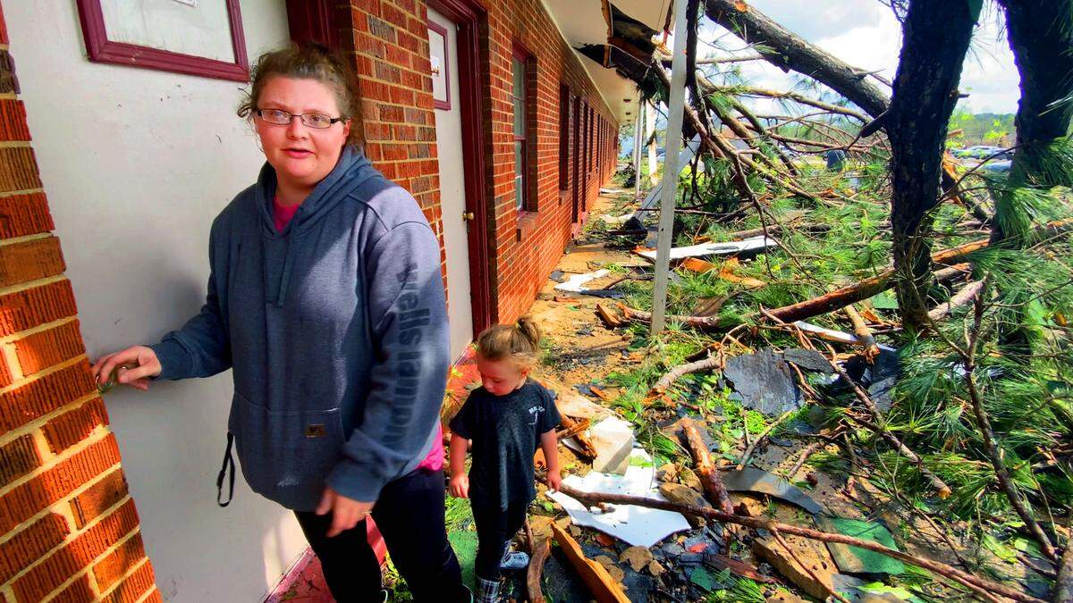 Dawn Monroe and her daughter Chelsey Monroe leave the room at the West Point Motel that Dawn’s uncle James Sheppard was in when the tornado struck Sunday morning. 03/27/2023