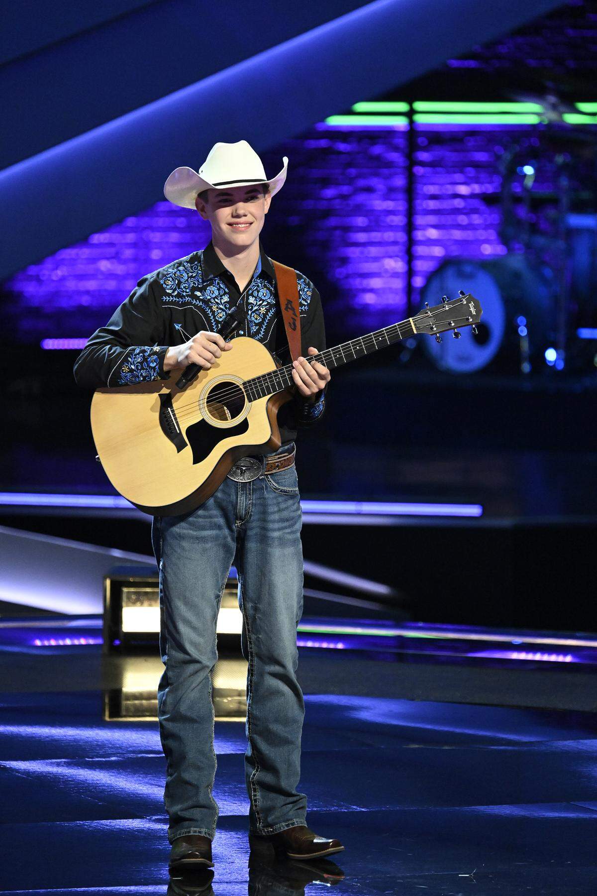 AJ Robinson of Cataula in Harris County, a ninth-grader at Calvary Christian School in Columbus, is on stage at Universal Studios in Hollywood, California, during the Feb. 23, 2026, episode of the singing competition TV show “The Voice” on NBC.