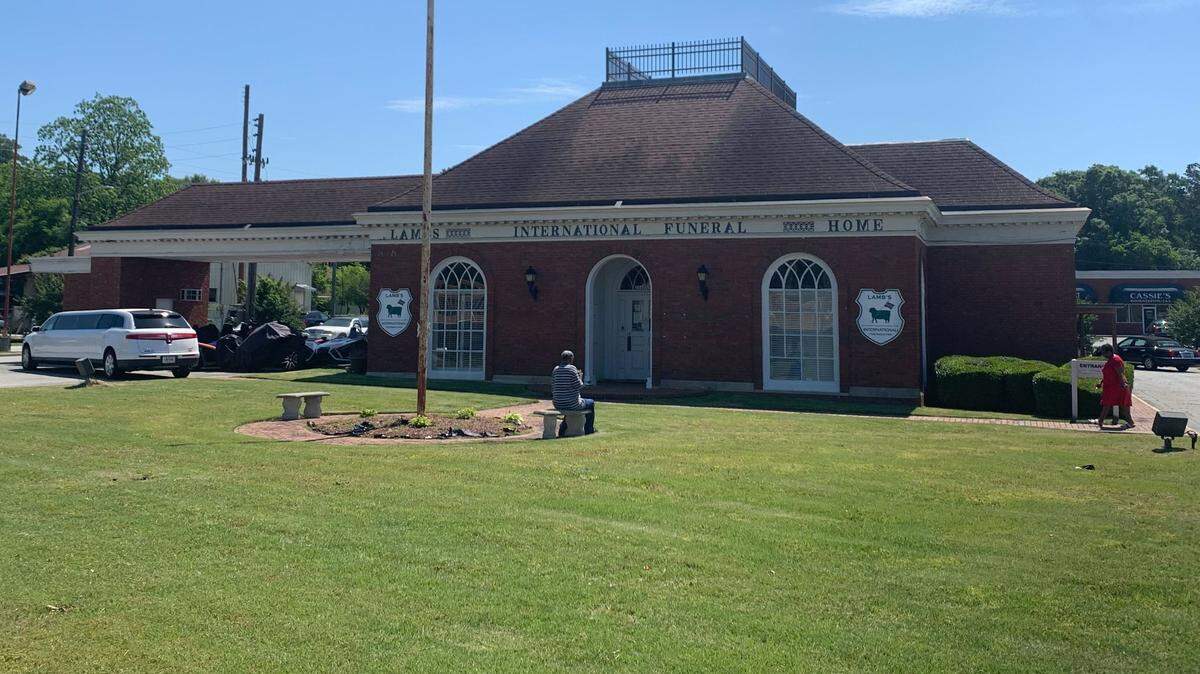 A man died in a funeral home parking lot after suffering an apparent heart attack in Columbus.