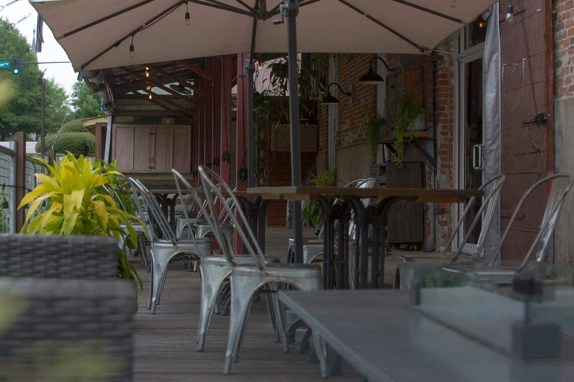 Umbrellas shade the patio at 11th and Bay, 1050 Bay Avenue, in Columbus, Georgia, on June 28, 2021.