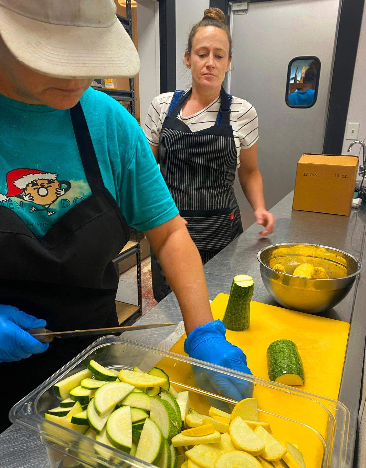 Brittney Espersen,right, the general manager/chef at The Food Mill in Columbus, Georgia, works with Wendy Smith, an intern at The Food Mill from the Truth Spring Trade School.