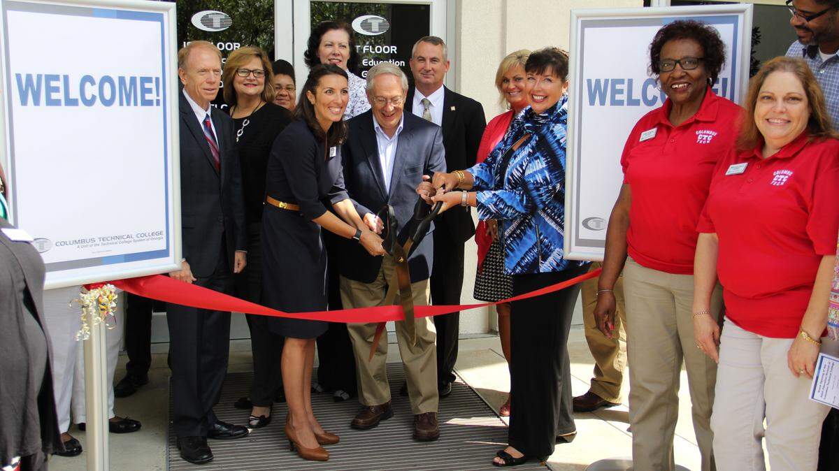 COURTESY OF COLUMBUS TECHNICAL COLLEGE 
 Officials celebrate Thursday's opening of the new adult education headquarters at Columbus Technical College. Pictured, from left, are: Steve Pearce, Technical College System of Georgia grant support coordinator; Barbara Moushon, Chattahoochee Valley Certified Literate Community Program director; Crystal Waye, instructor; April Hopson, adult education director; Billie Izard, Georgia CLCP executive director; Pine Mountain Mayor Jim Trott, a Columbus Tech board member; David McCurry, Chattahoochee County School District superintendent; Janeen Tucker, Greater Columbus Chamber of Commerce vice president for economic development; Lorette Hoover, Columbus Tech president; Hattie Bailey, adult education budget specialist; Mary Anne Woyke, adult education data specialist; and Termayne Calhoun, instructor.
