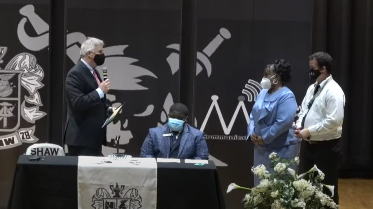 From left, Columbus Mayor Skip Henderson speaks Nov. 1, 2021, to Shaw High School senior class president Mitchell Harris, principal Sureya Hendrick and assistant principal Andrew Smith during their discussion about leadership and opportunities in the community.