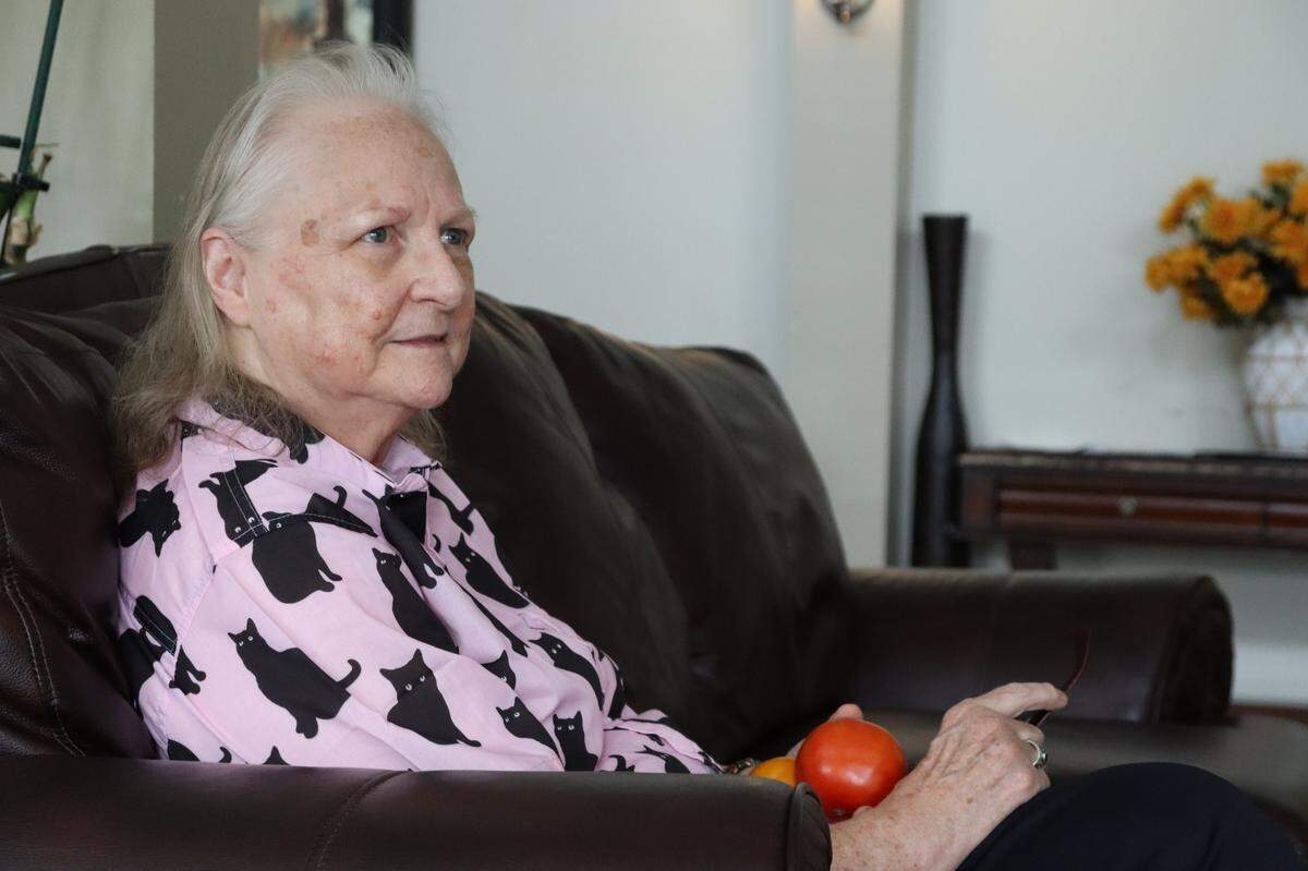 Sharon “Ila” Smith, 74, in the lobby of the Veranda. She’s holding two tomatoes her neighbor gave her just before she sat down to speak with the L-E.