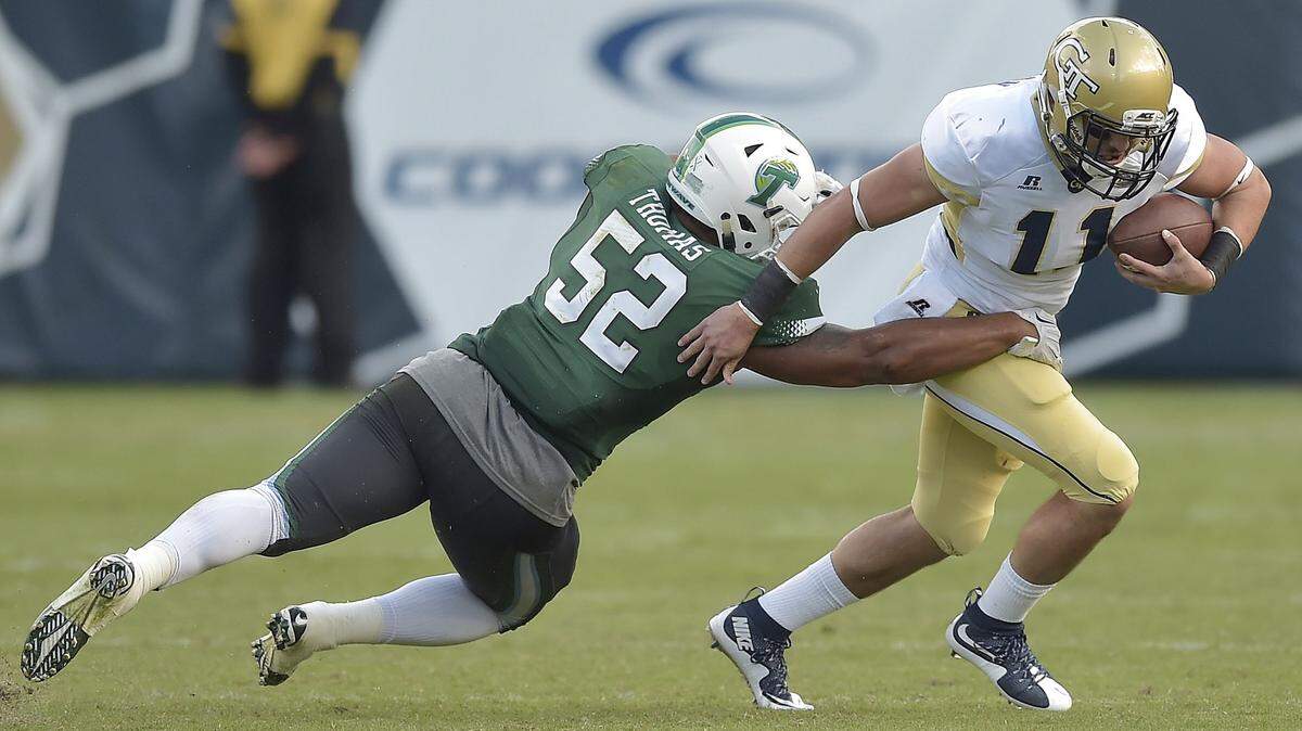 MIKE STEWART/Associated PressTulane linebacker Eric Thomas tackles Georgia Tech quarterback Matthew Jordan during the second half Saturday in Atlanta. Georgia Tech won 65-10.