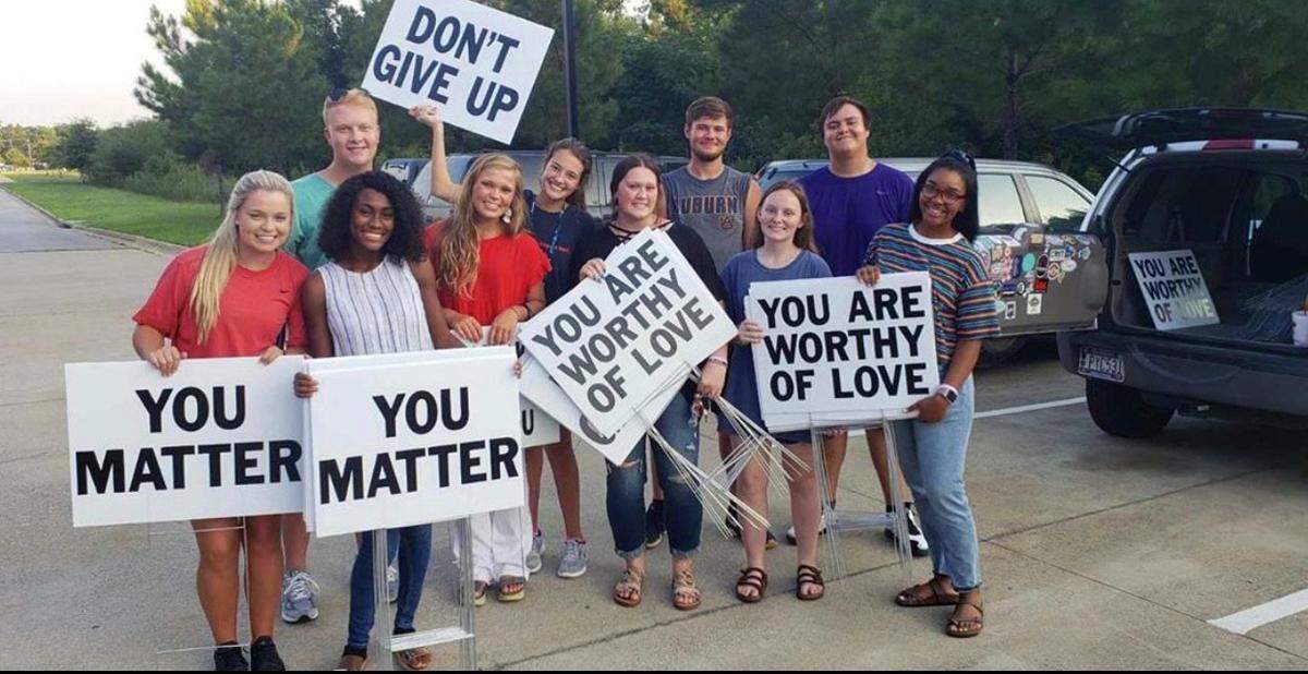 Signs with positive statements once again greet drivers in Smiths Station, Alabama. The signs are an effort to fight suicide and raise awareness about mental health issues. They’re posted by the group “Smiths Station Not One More.”