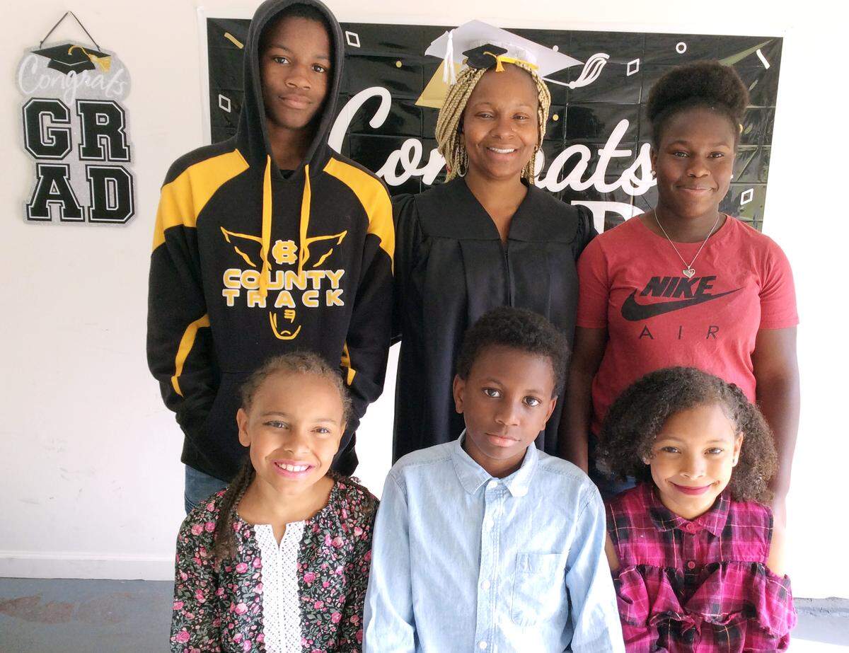 Chavala Burse celebrated her graduation from Columbus State University with a small party at her home in Hamilton, Georgia, on Thursday, May 21, 2020. Pictured with Burse are her five children. Top row, from left: Quinton Lewis and Chaquiria Wesley. Bottom row, from left: Alanna Favors, Jamie Lewis and Atalie Favors.