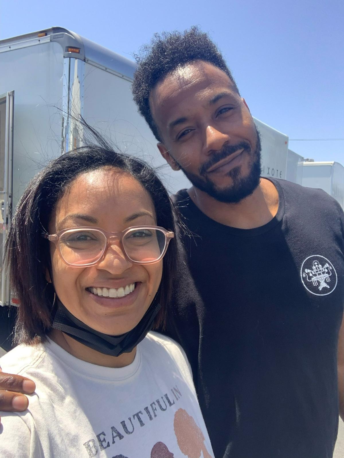 Natalia Temesgen, a Columbus State University associate professor of English, poses with actors Eugene Byrd, left, and Michael Ealy, on the set of the Hulu TV series “Reasonable Doubt” in May 2022 in Los Angeles. She is one of two executive story editors and among eight writers for the show.