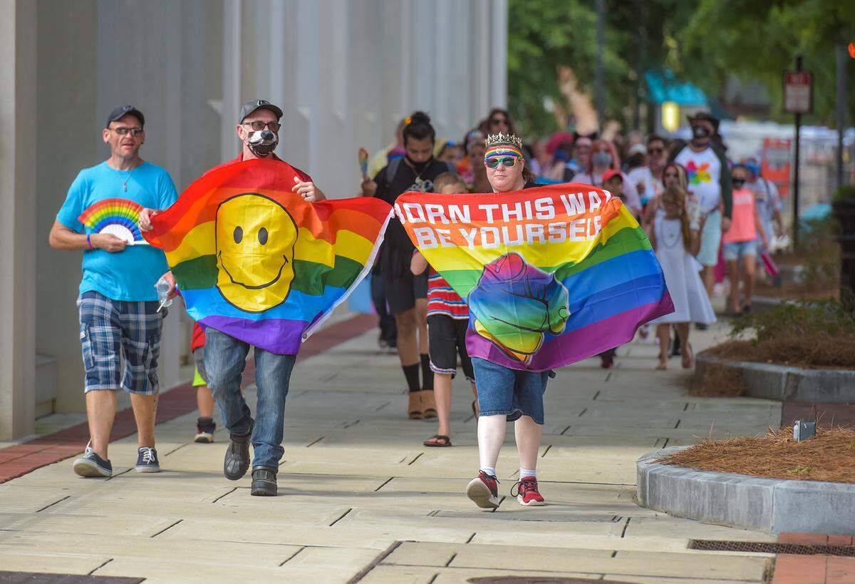 Colgay Pride attendees parade along Broadway during the 2020 Columbus Georgia LGBT Pride Festival, Saturday, August 1, 2020.