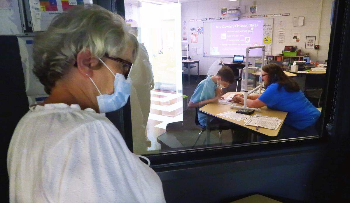 Lisa Jenkins looks in on her son George’s class at Jordan Vocational High School in Columbus.