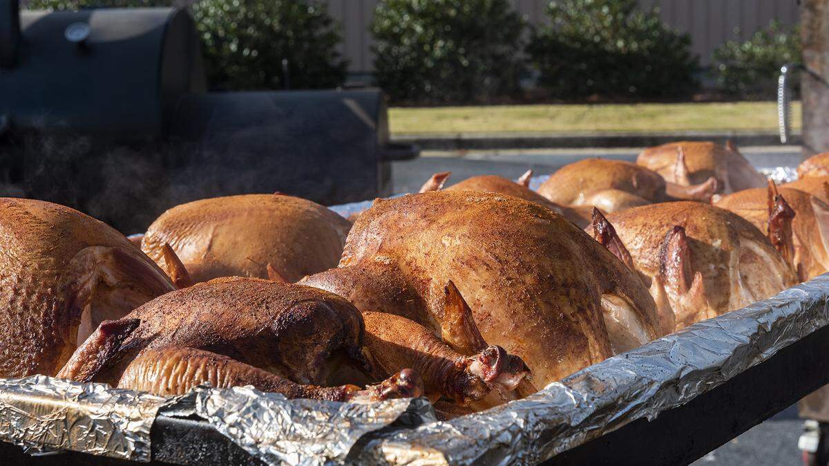 Masterbuilt used 12 smokers to cook 103 turkeys in the parking lot of of its headquarters on November 26, 2019. The turkeys will be served on Thanksgiving Day at Valley Rescue Mission.